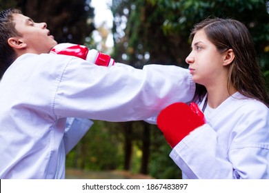 People High Kicks During Training Of Taekwondo Outdoors Bamboo Background