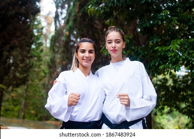 People High Kicks During Training Of Taekwondo Outdoors Bamboo Background