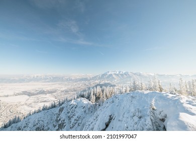 People Hiking In Beautiful Winter Mountains For Winter Sport Activity Snow Mountain Hills. Visit Piatra Craiului National Park To See Its Iconic Rocky Monolith Winter Hiking