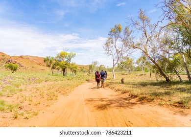 People Hiking On A Hot Day Along A Track In The Pilbara Region In North Western Australia, Australia.