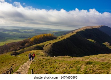 People Hiking On A Trail In The Peak District