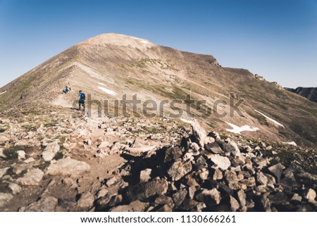People hiking up the steep section of Quandary Peak in Colorado. 
