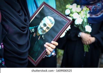 People Hold Portrait Of The Iranian General Qasem Soleimani As They Attend The Condolence Ceremony Outside The Iranian Embassy In Kuala Lumpur January 8, 2020.