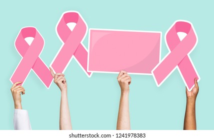 People holding breast cancer awareness ribbons