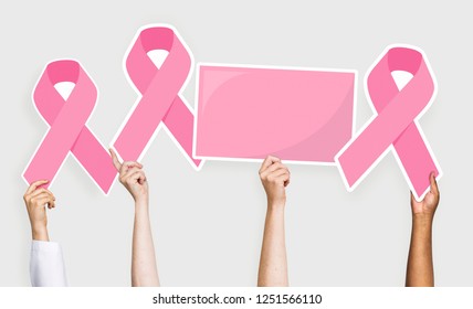People holding breast cancer awareness ribbons