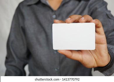 People Holding A Business Card