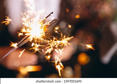 People holding Christmas lights and bonfires - Powered by Shutterstock