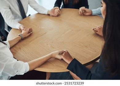 People, holding hands and praying at table for faith, worship and compassion in religion. Praise group, friends and gesture in facility for community program, empathy and gratitude to God in church - Powered by Shutterstock