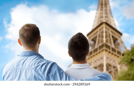 People, Homosexuality, Same-sex Marriage, Travel And Love Concept - Close Up Of Happy Male Gay Couple Hugging From Back Over Paris Eiffel Tower Background