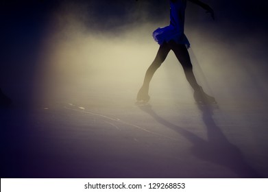 People ice figure skating with beautiful light effect.