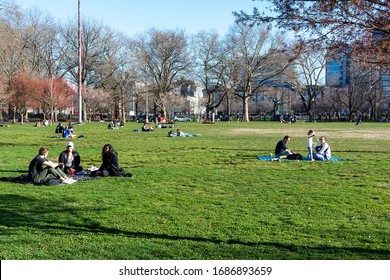 People Ignoring The Coronavirus Social Distancing Mandate And Picnicking In McCarren Park, Brooklyn, NY, USA On March 27, 2020