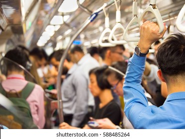 People Inside The Crowded Metro Train. Singapore