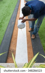 People Installation For Artificial Turf.