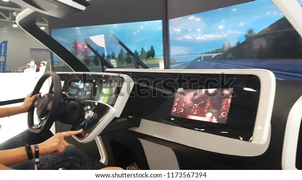 People in interactive
whiteboard driver's trainer at Moscow Automobile Salon. SEP 03,
2018 MOSCOW, RUSSIA