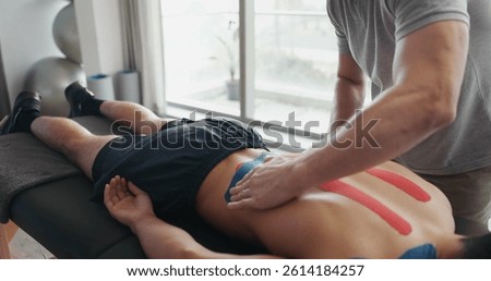 People, inversion table and upside down for physical therapy with support, balance and recovery at clinic. Physiotherapist, men and patient with fitness bench, biokinetics and rehabilitation process
