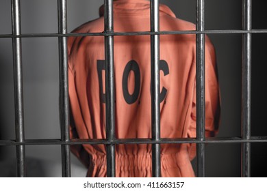 People In Jail - Caucasian Man In Prison Cell - Department Of Justice Orange Jump Suit