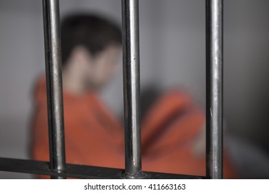 People In Jail - Caucasian Man In Prison Cell - Department Of Justice Orange Jump Suit