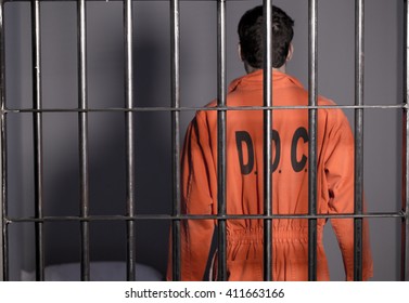 People In Jail - Caucasian Man In Prison Cell - Department Of Justice Orange Jump Suit