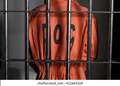 People In Jail - Caucasian Man In Prison Cell - Department Of Justice Orange Jump Suit