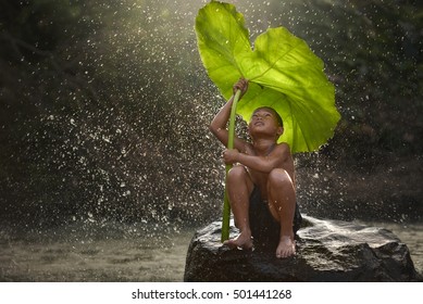 The People Joy Of A Country Boy Local In Laos  With Nature Boy Waiting For Rain..