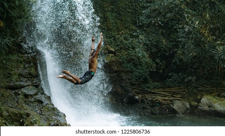 People Jump Into Amazing Waterfall, Man Enjoying Fresh Water Falls In The Forest