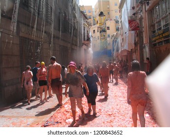 People In La Tomatina Of Bunyol, Valencia, Spain. August 2017