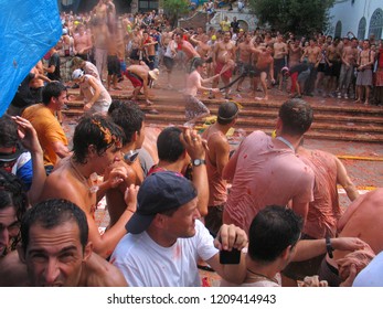 People In La Tomatina Of Bunyol, Valencia, Spain. August 2017