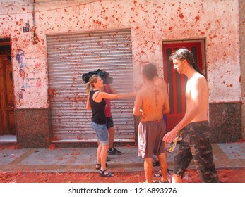 People In La Tomatina Of Bunyol, Valencia, Spain. August 2017