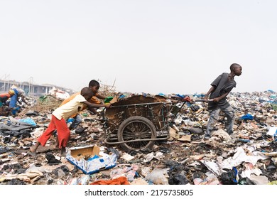 People At A Landfill Site In West Africa Recycling Household And Industrial Waste