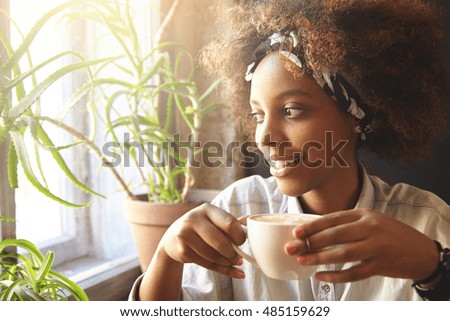 Similar – Image, Stock Photo woman having a cup of tea at home during breakfast. Cute golden retriever dog besides. Healthy breakfast with fruits and sweets. lifestyle indoors