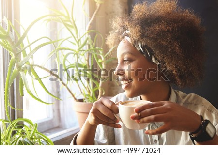 Similar – Image, Stock Photo woman having a cup of tea at home during breakfast. Cute golden retriever dog besides. Healthy breakfast with fruits and sweets. lifestyle indoors