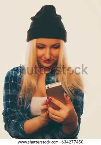 People, lifestyle and tehnology concept: pretty teen girl  with smart phone - isolated on white