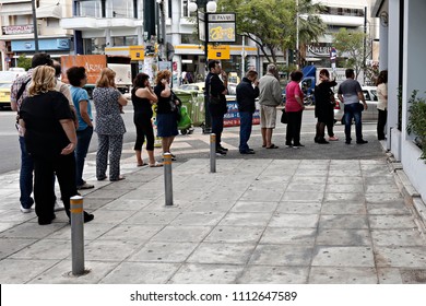 People Line Up Outside A Piraeus Bank Branch To Use ATM Machine, In Athens, Greece On Jun. 27, 2015
