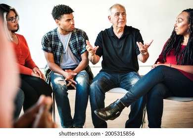 People listening to a speaker in a rehab session - Powered by Shutterstock