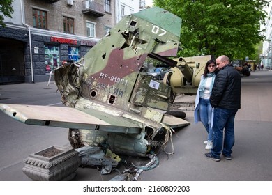 People Look At A Fragment Of A Russian Military Aircraft During An Exhibition Displaying Destroyed Russian Military Equipment Amid Russian Invasion Of Ukraine In Kyiv, Ukraine. May 8, 2022.