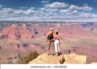 People look out on the Grand Canyon