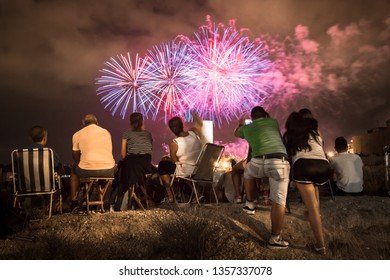 People looking at firework