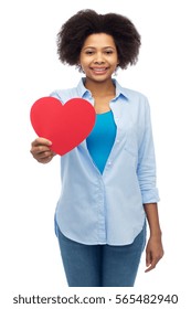 People, Love, Valentines Day And Health Concept - Happy African American Young Woman With Red Heart Shape Over White