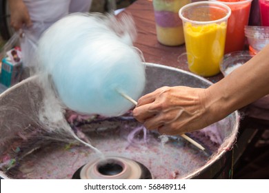 People are making cotton candy machine.
