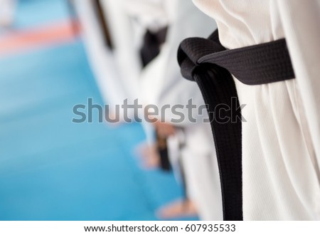 People in martial arts training exercising Taekwondo. 