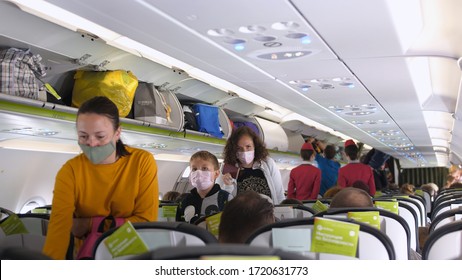 People With Masks Get On Airplane. Passengers Wearing Surgical Mask To Prevent Infection From Coronavirus. Thailand, Bangkok, 13 April 2020