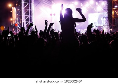 A lot of people at the mass event. Concert crowd - Shutterstock ID 1928002484