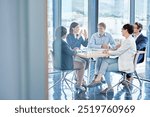 People, meeting and feedback in office for business, marketing strategy and finance management. Corporate team, woman speaker and discussion at table with report, paper or planning for upcoming audit