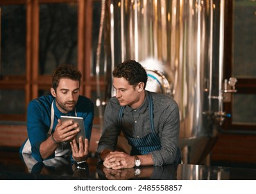 People, men and tablet with research together for liquor licence, startup and craft beer in brewery. Entrepreneur team, friends and tech for funding faq, equipment sale and web article in distillery - Powered by Shutterstock