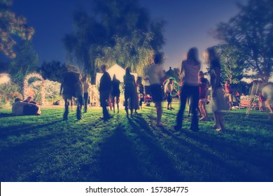  People Mingling At A Free Concert By Local Musicians 