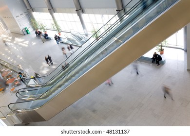 People at modern building and elevators