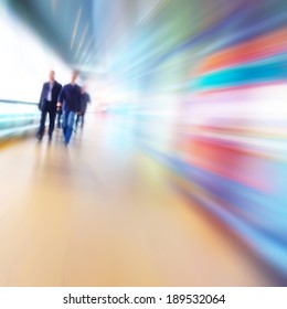 People In Motion Blur Walking In The Office Corridor.