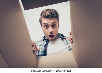 People Move Home House Transporting Things Staff People Person Concept. Close Up Portrait Of Shocked Surprised Handsome Guy Looking Into The Empty Cardboard Box With Open Mouth