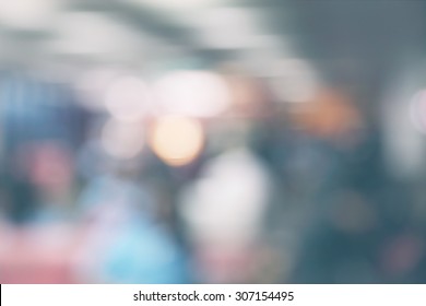 People Moving At The Airport In Abstract Art Out Of Focus Blur