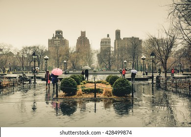 People in New York City, New York, America in the rainy day of winter.  New York City is centered of finance and fashion of the world. New York City is the most populous city in the United States. - Powered by Shutterstock